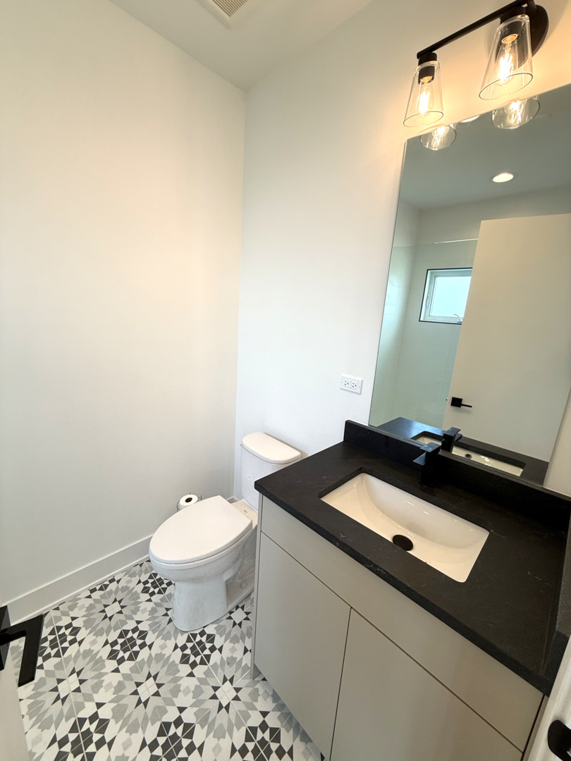 26 Natalie Lane Lake Zurich, IL 60047 - Photo 7 of 18 a bathroom with a sink and a toilet