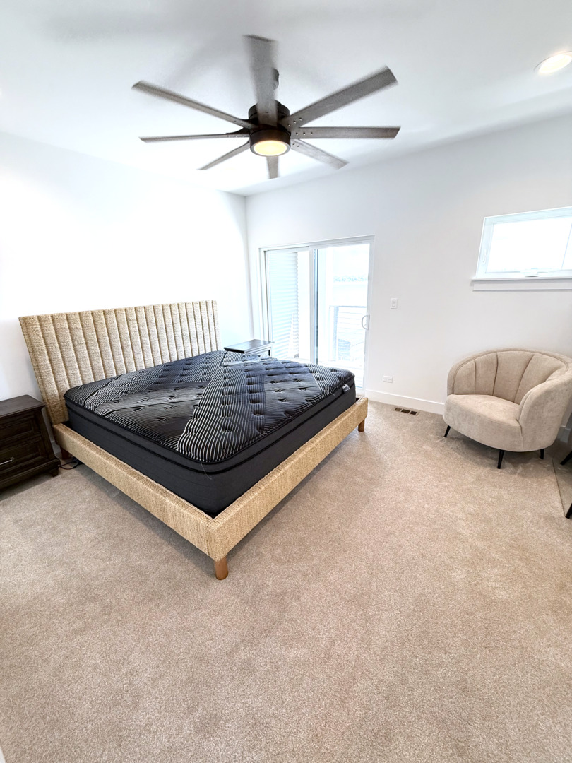 26 Natalie Lane Lake Zurich, IL 60047 - Photo 9 of 18 a bed room with a bed and a couch