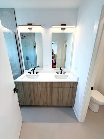 a bathroom with a sink a mirror and a bathtub