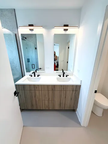 a bathroom with a sink a mirror and a bathtub