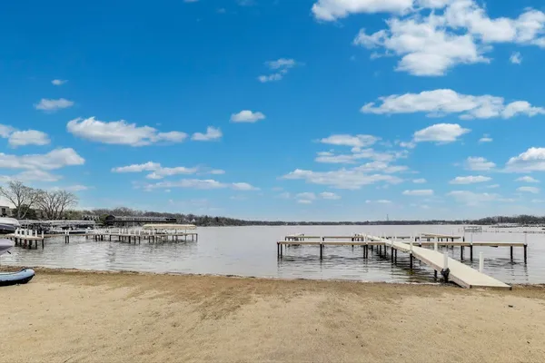 a swimming pool with outdoor seating and yard