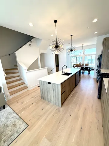 a large room with wooden floor and furniture