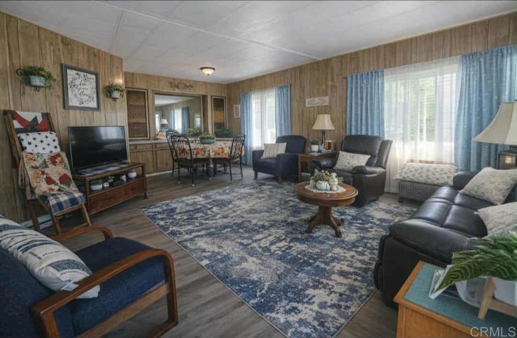 1815 Sweetwater, Unit 1 Spring Valley, CA 91977 - Photo 18 of 34 a living room with furniture a window and a flat screen tv
