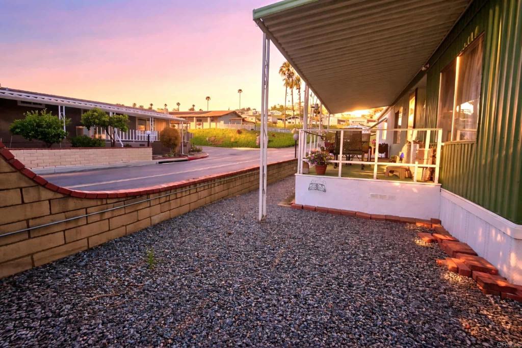 1815 Sweetwater, Unit 1 Spring Valley, CA 91977 - Photo 6 of 34 a view of a backyard with lawn chairs