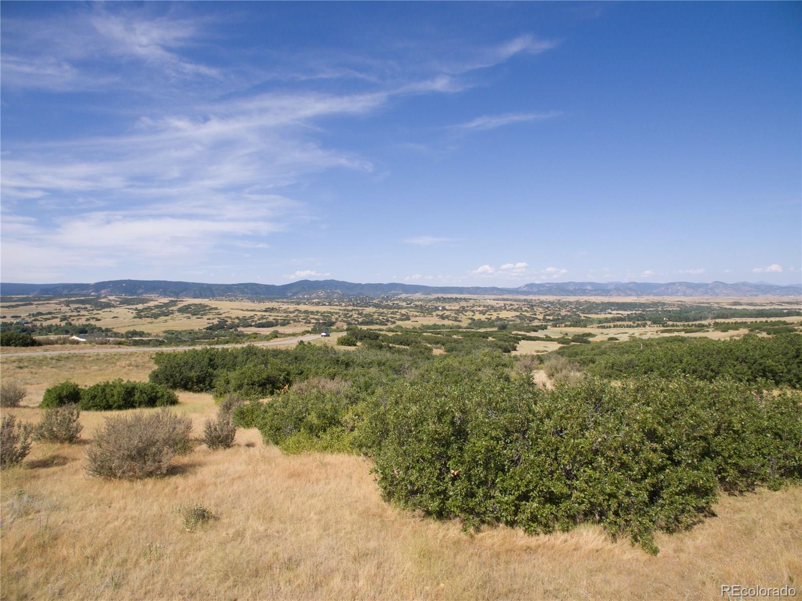 3226 Keep Drive Sedalia, CO 80135 - Photo 3 of 14 a view of a lake with a city