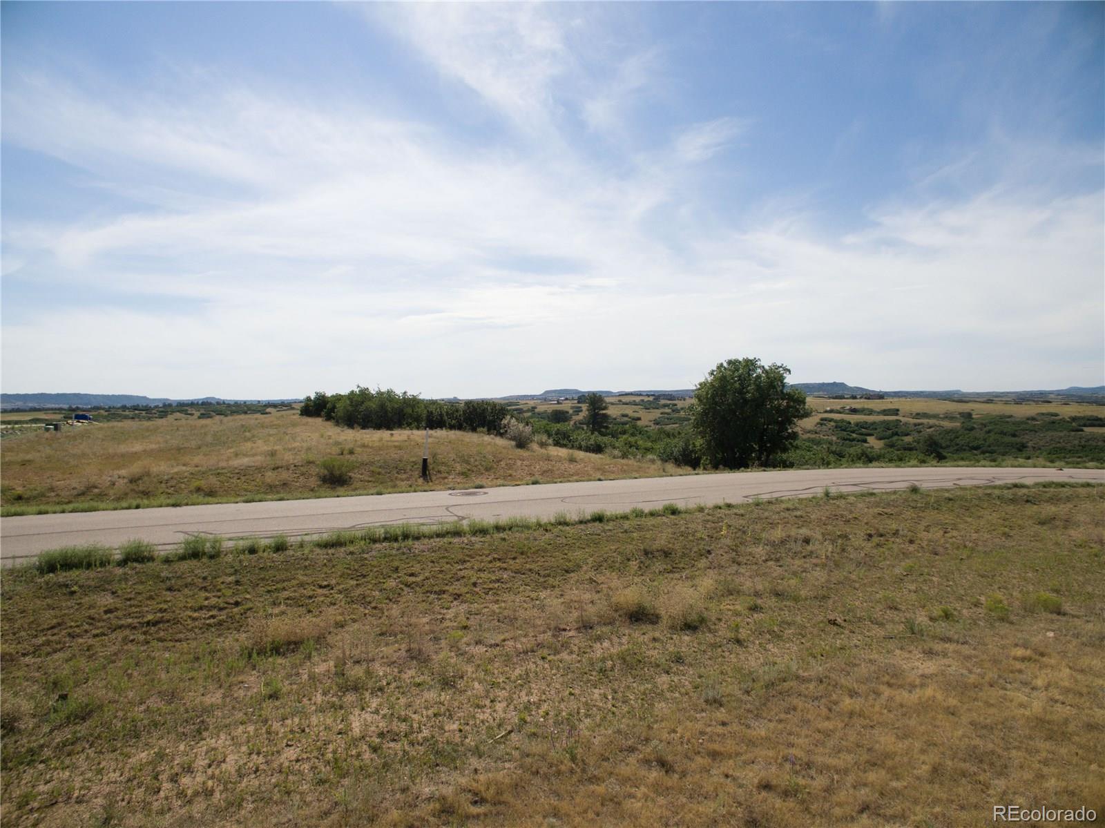 3226 Keep Drive Sedalia, CO 80135 - Photo 10 of 14 a view of an ocean beach and mountain
