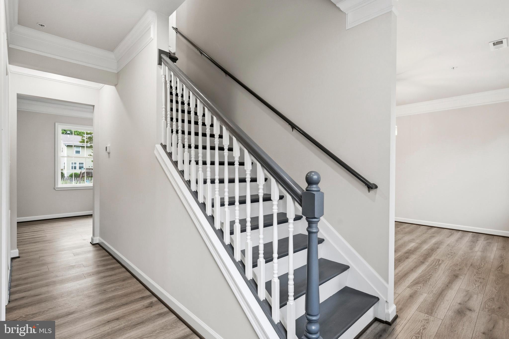 29725 Bruce Road Mechanicsville, MD 20659 - Photo 29 of 79 a view of staircase with wooden floor and white walls