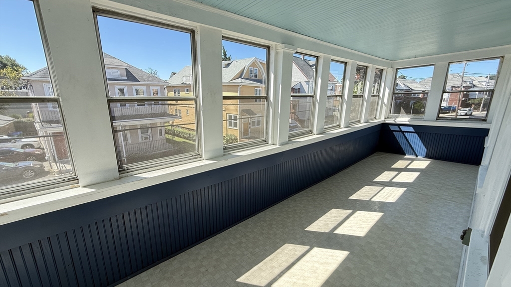 12 Eliot Street, Unit 12 Medford, MA 02155 - Photo 10 of 11 a large white building with a view of balcony