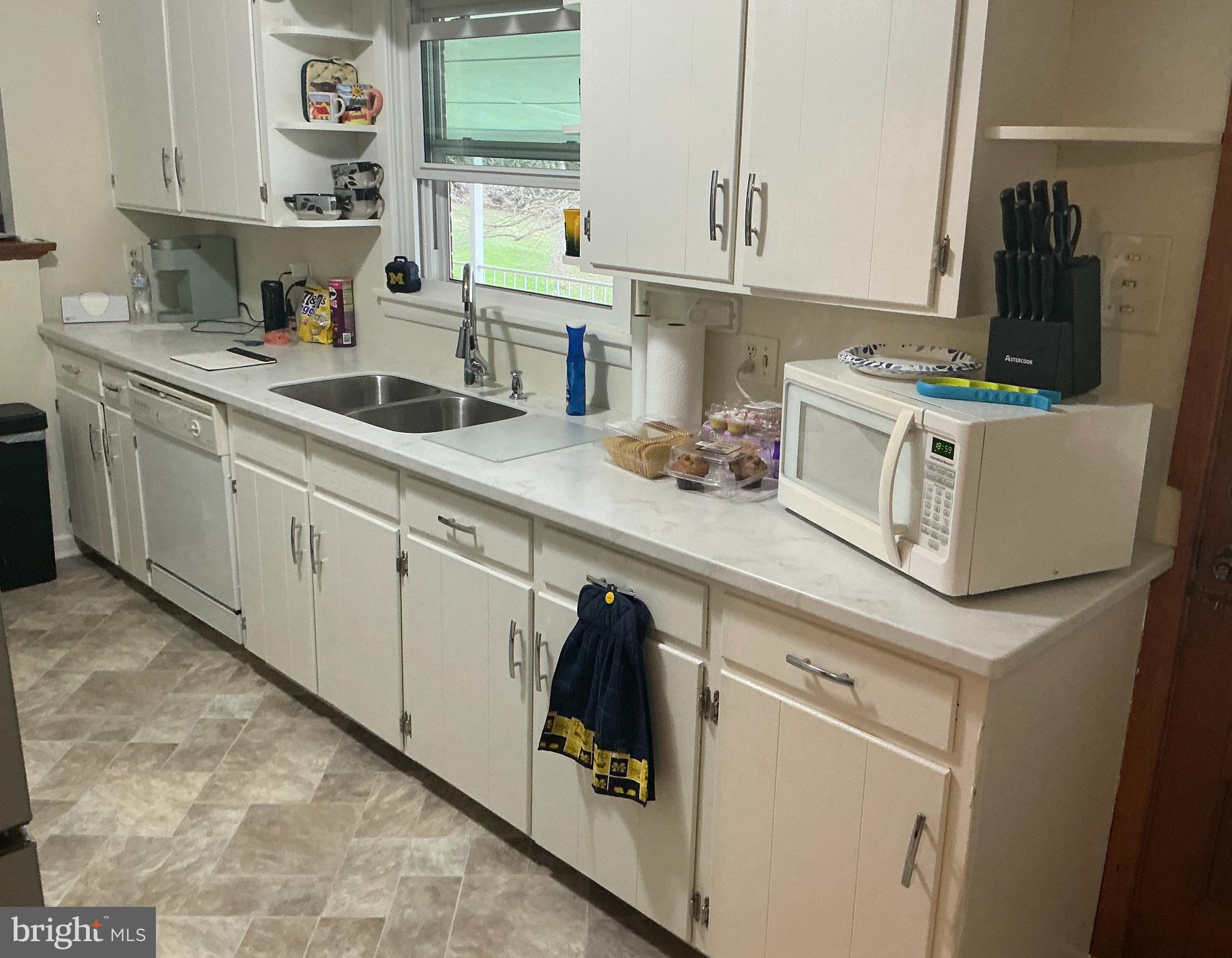 6150 Chambers Hill Road Harrisburg, PA 17111 - Photo 12 of 24 a kitchen with cabinets appliances a sink and a counter top space