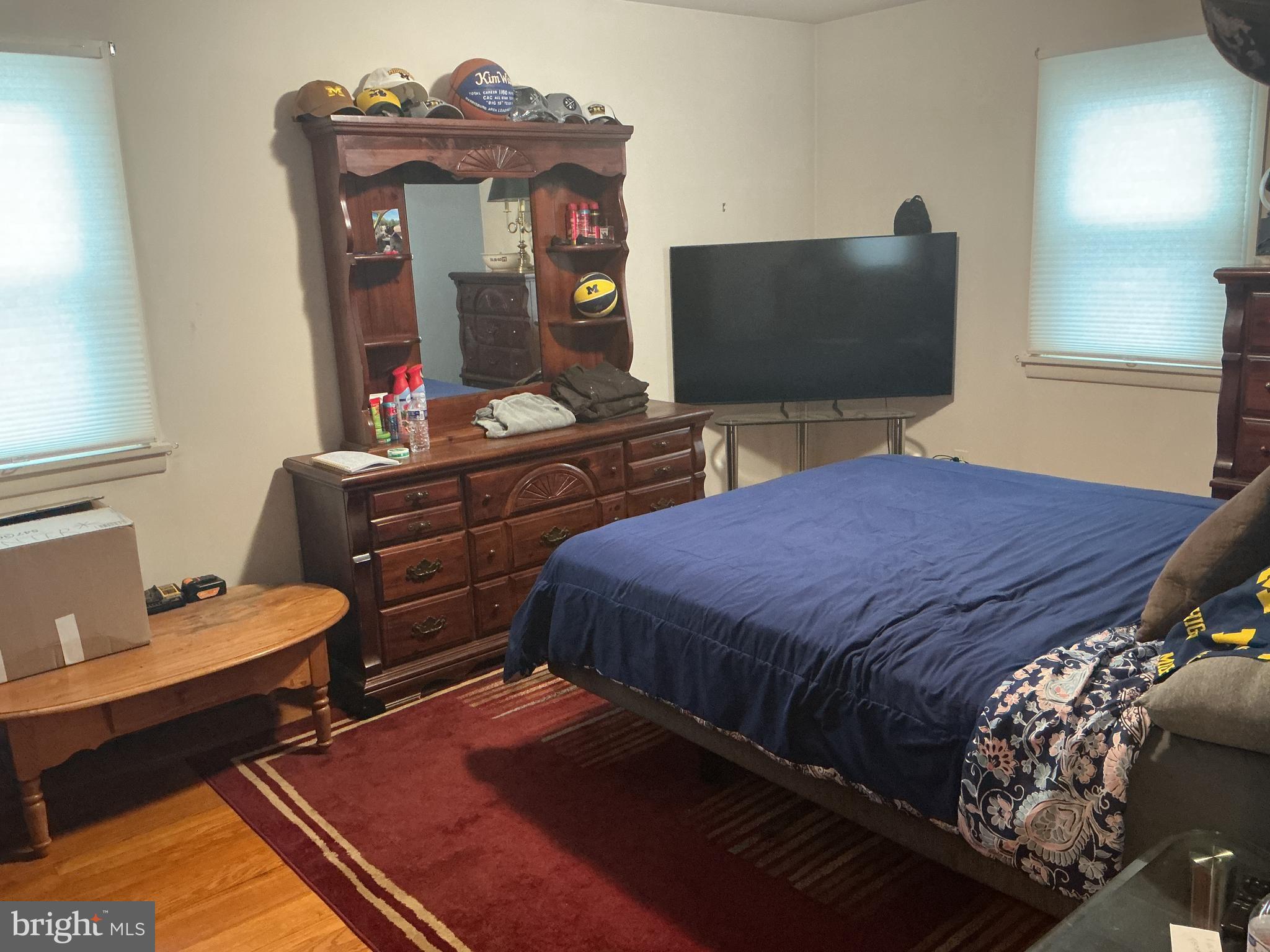 6150 Chambers Hill Road Harrisburg, PA 17111 - Photo 17 of 24 a bedroom with a bed and a flat screen tv