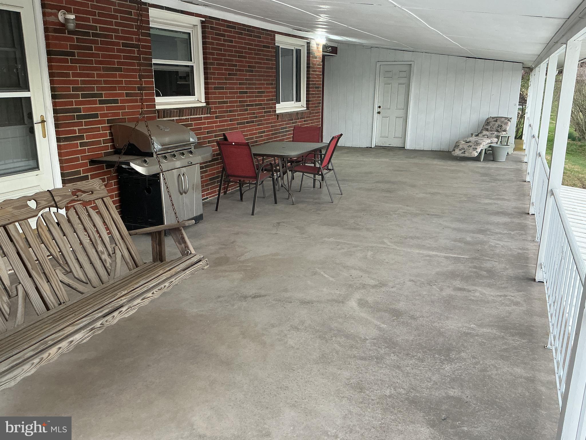 6150 Chambers Hill Road Harrisburg, PA 17111 - Photo 5 of 24 a view of a patio with table and chairs