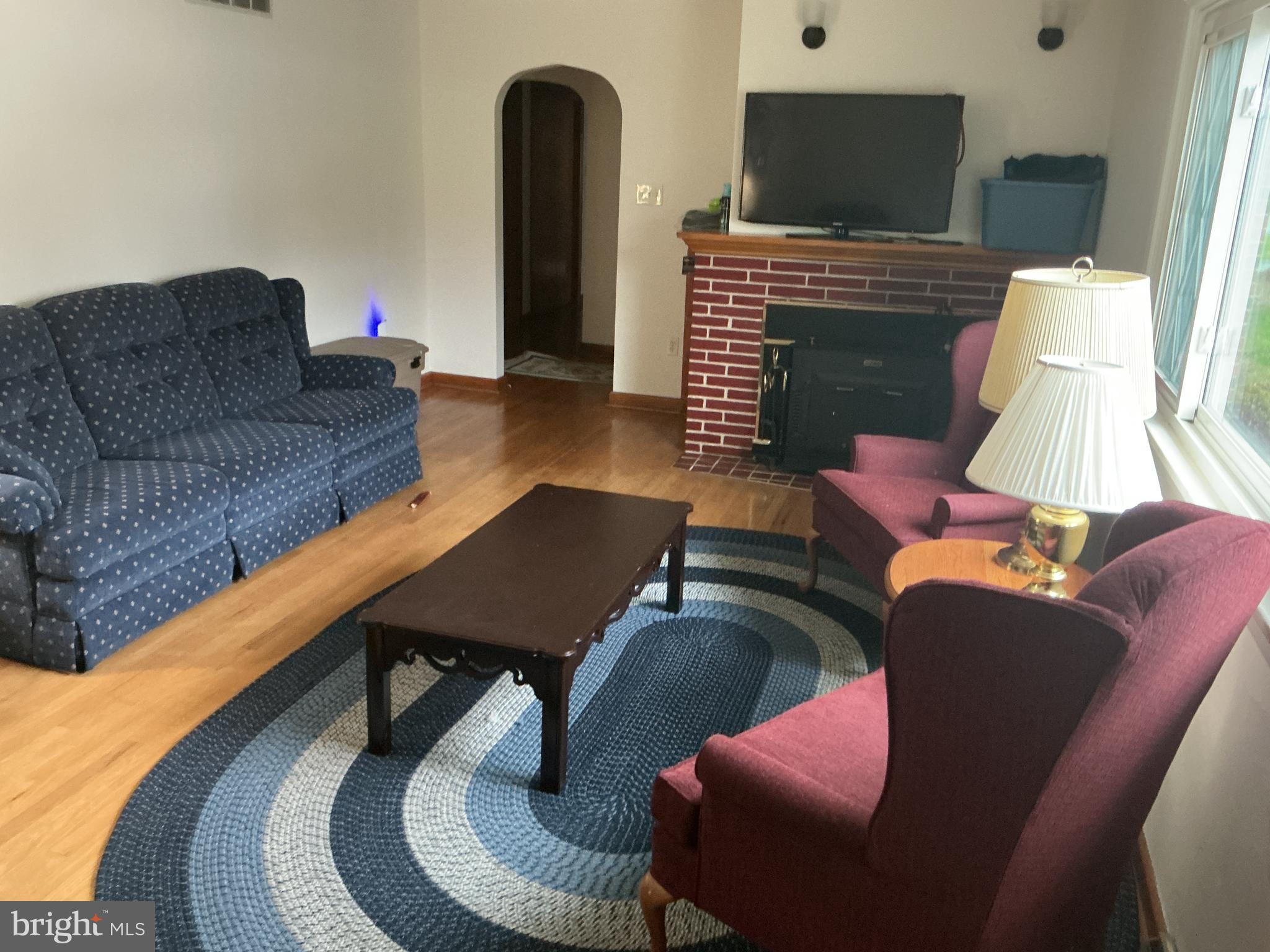 6150 Chambers Hill Road Harrisburg, PA 17111 - Photo 8 of 24 a living room with furniture and a fireplace