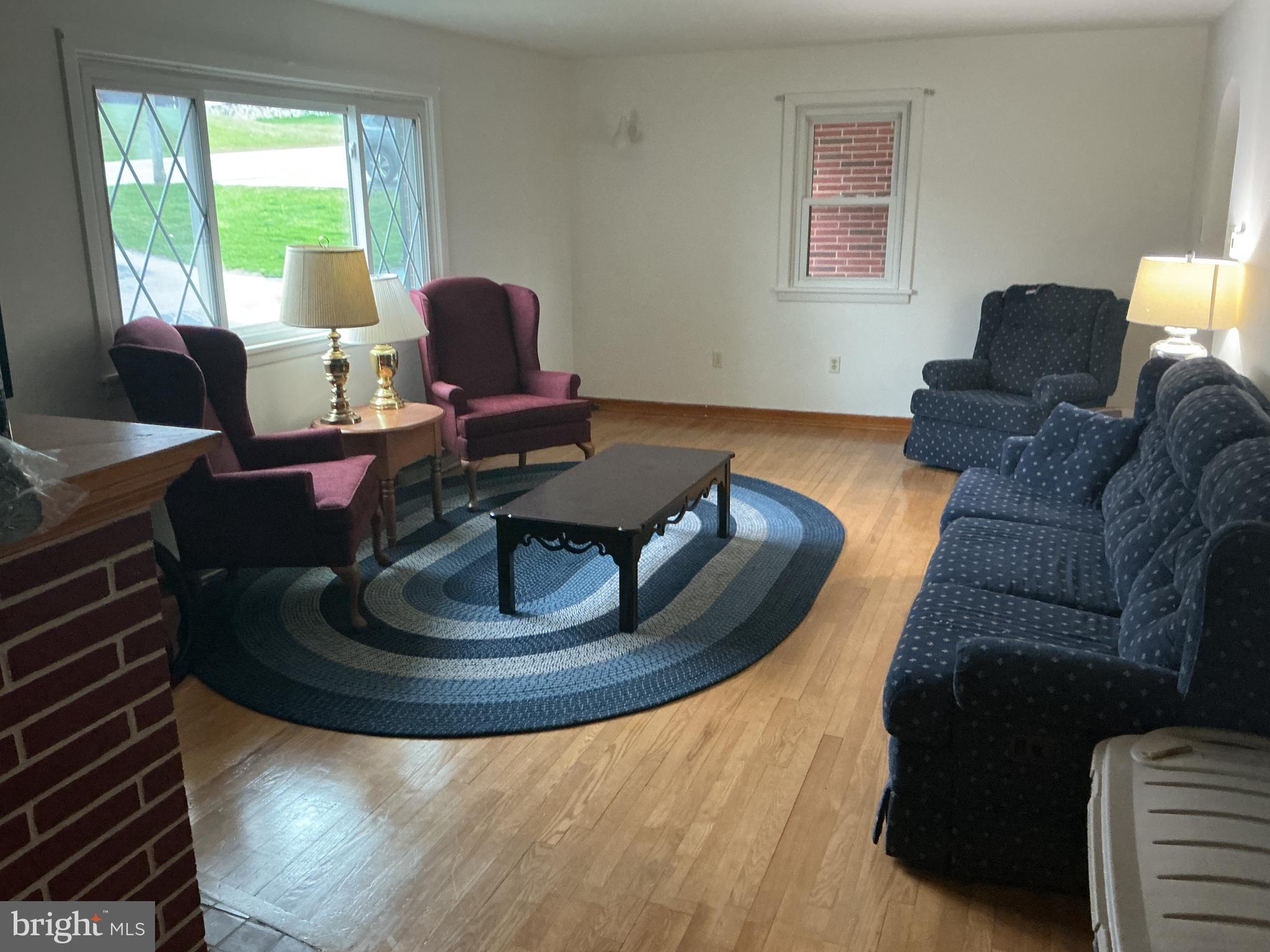 6150 Chambers Hill Road Harrisburg, PA 17111 - Photo 9 of 24 a living room with furniture and a lamp