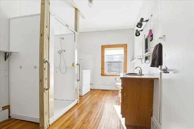 a view of a storage & utility room with a window
