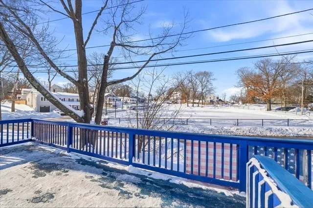 a picture of a bench in front of a wall