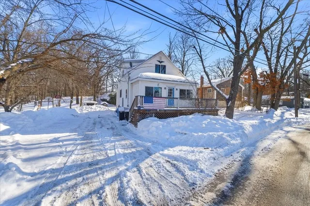 a view of house with a yard