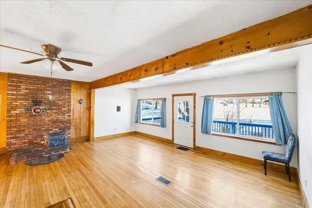a view of livingroom with hardwood floor and a ceiling fan