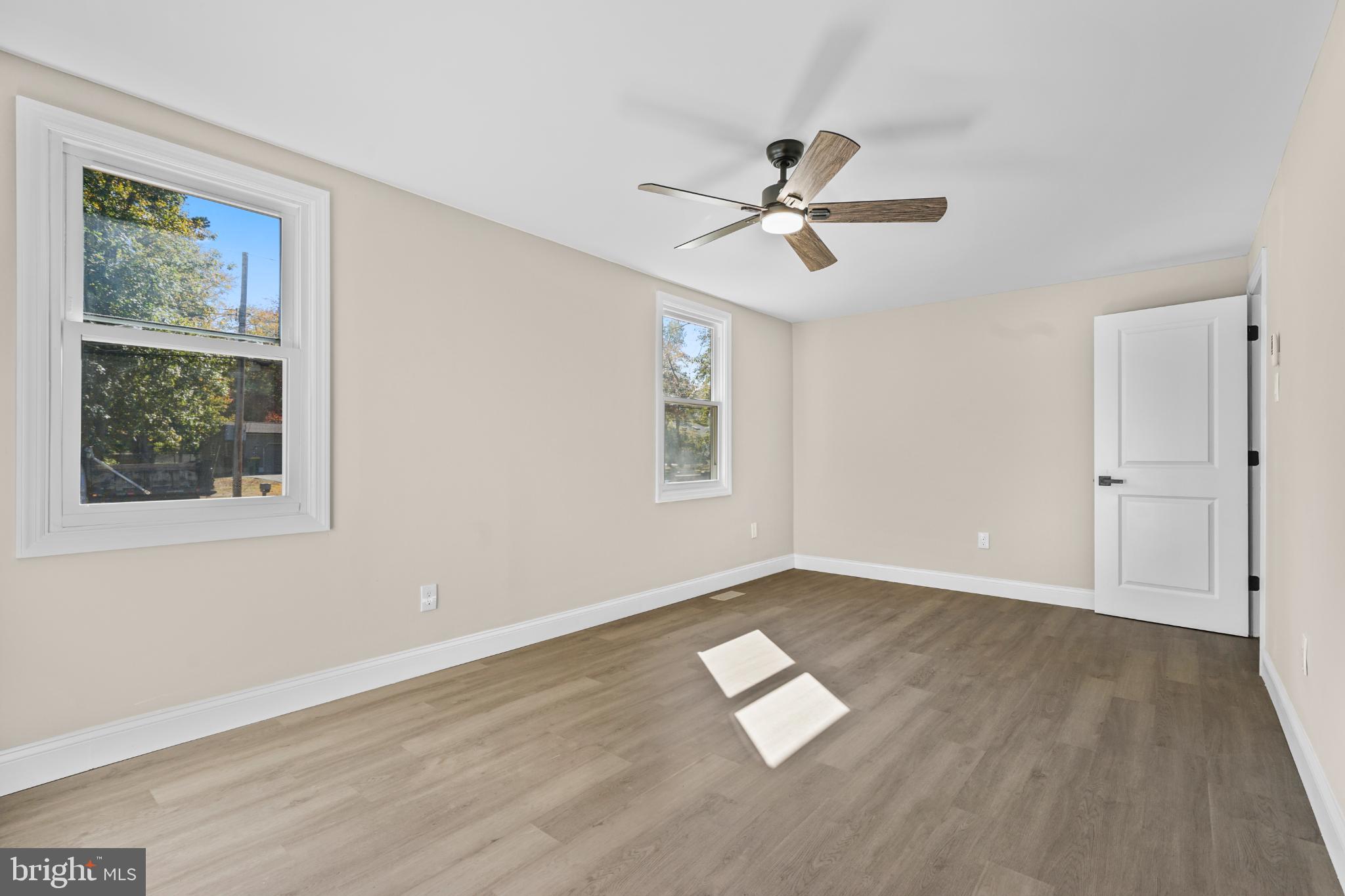 393 East Millstream Road Cream Ridge, NJ 08514 - Photo 15 of 29 a view of empty room with wooden floor and fan