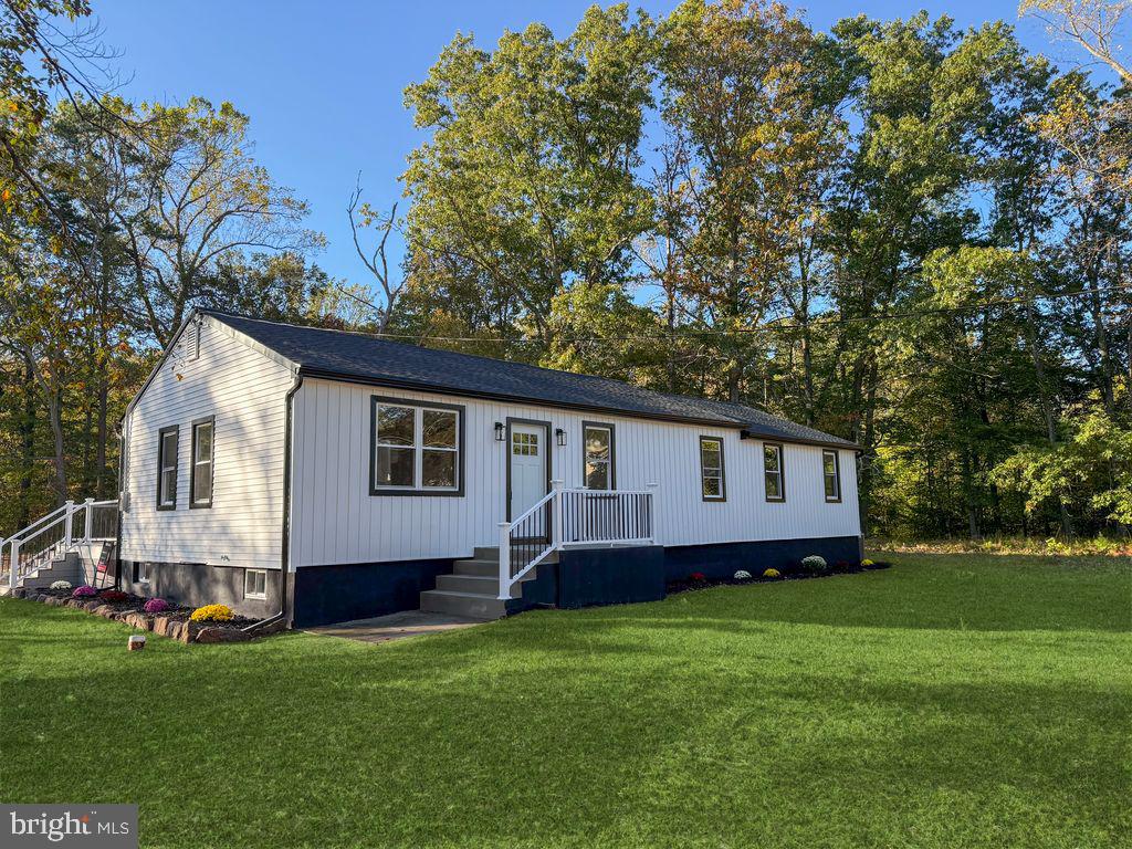 393 East Millstream Road Cream Ridge, NJ 08514 - Photo 2 of 29 a view of a house with a backyard