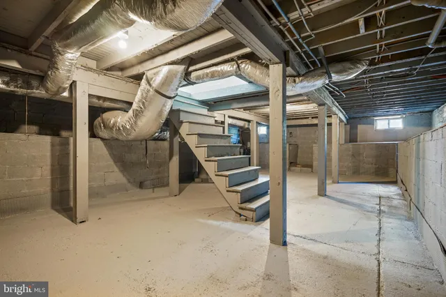 a view of an empty room with wooden roof