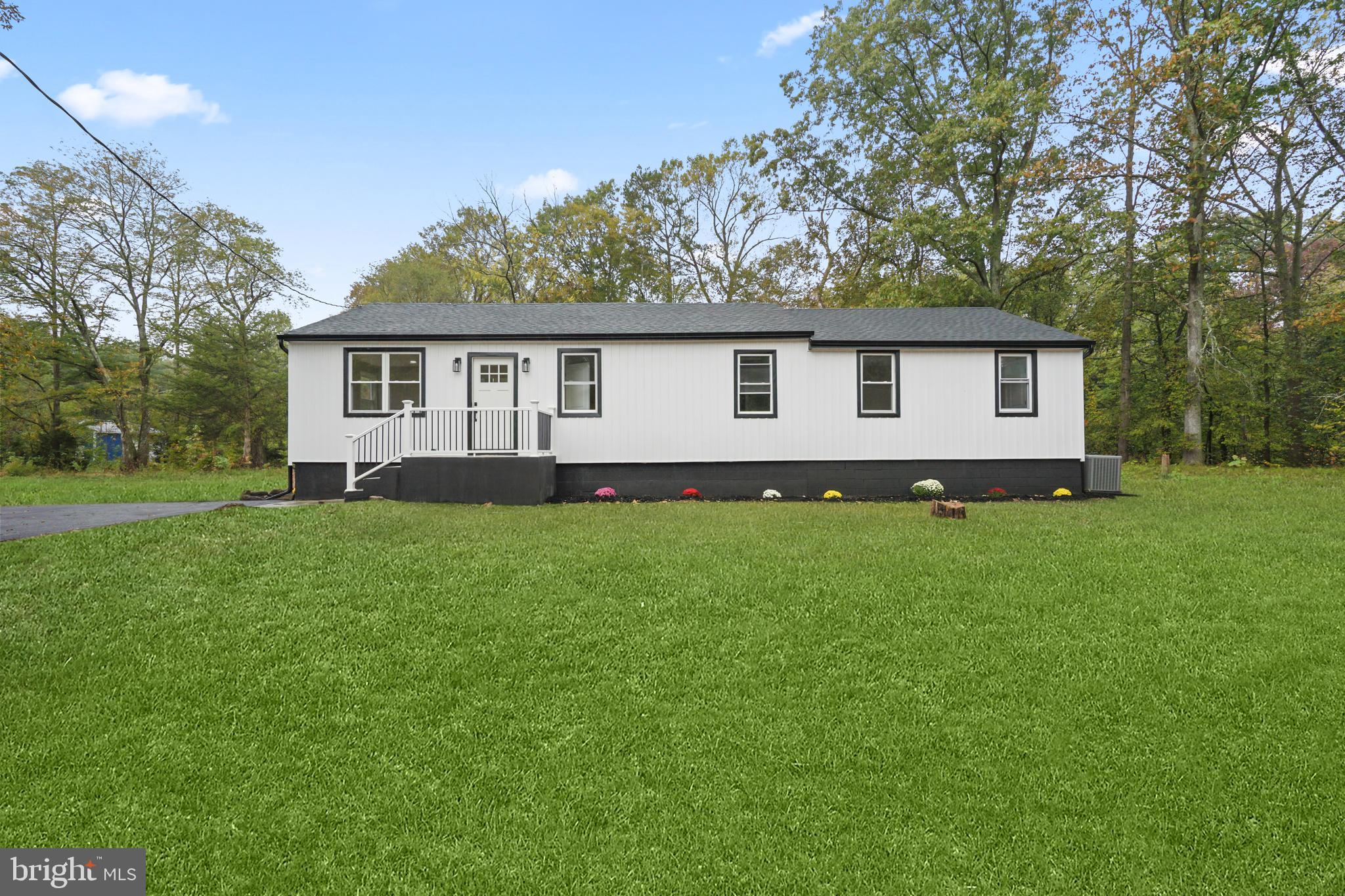 393 East Millstream Road Cream Ridge, NJ 08514 - Photo 23 of 29 a view of a house with a yard