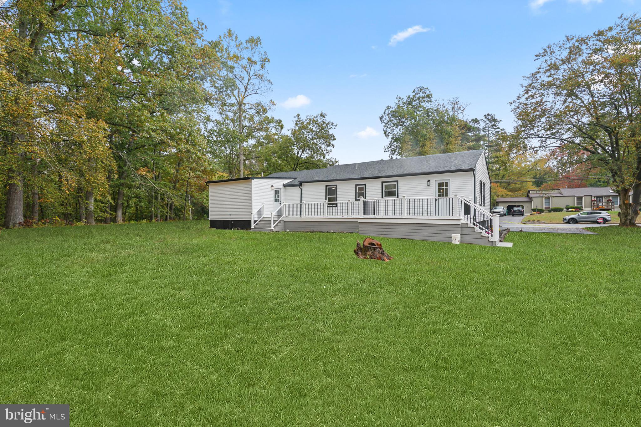 393 East Millstream Road Cream Ridge, NJ 08514 - Photo 29 of 29 a view of a house with backyard and deck