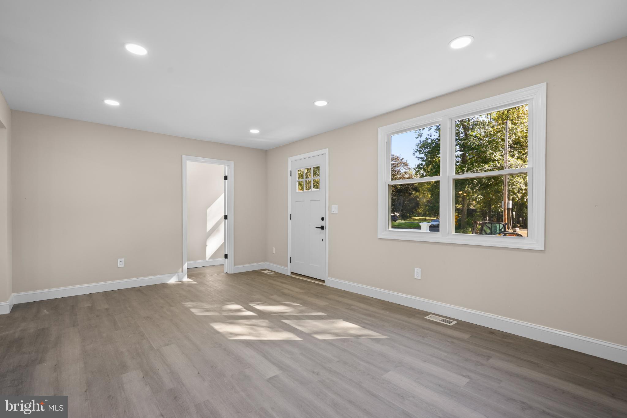 393 East Millstream Road Cream Ridge, NJ 08514 - Photo 5 of 29 a view of empty room with wooden floor and fan