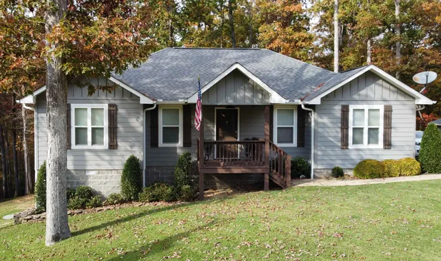 a front view of house with yard outdoor seating and barbeque oven