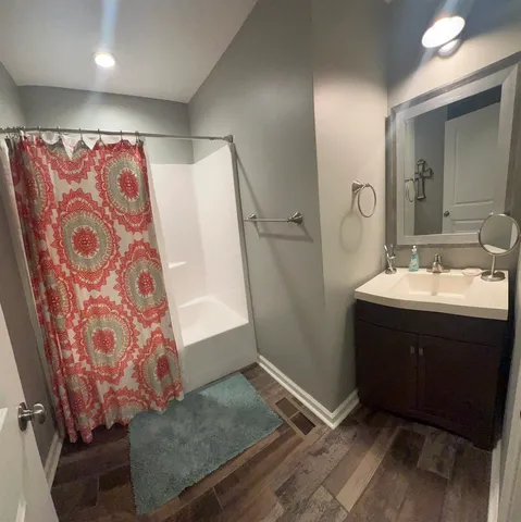 a bathroom with a sink and mirror