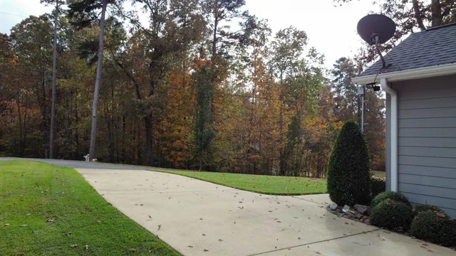 a backyard of a house with lots of green space