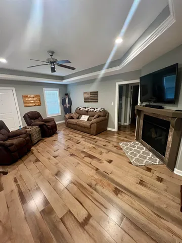 a bedroom with furniture and a flat screen tv