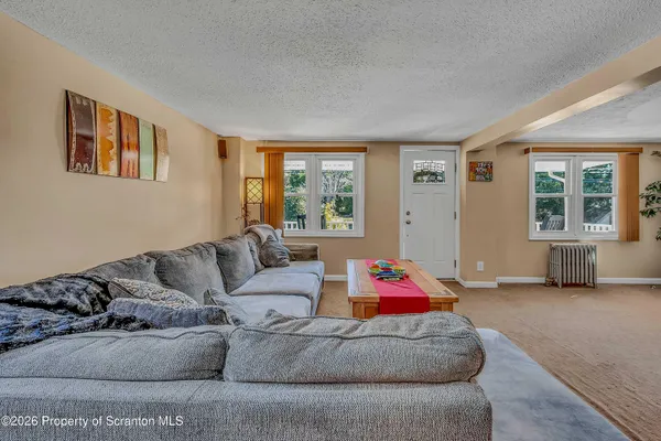 a living room with furniture and a window