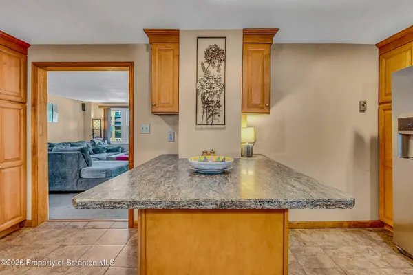 a view of a kitchen with granite countertop