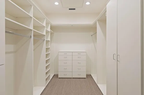 a bathroom with a double vanity sink mirror and shower