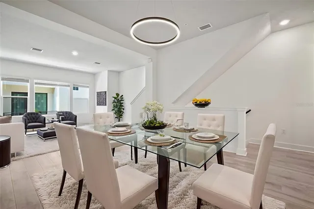 a bedroom with a bed and a potted plant