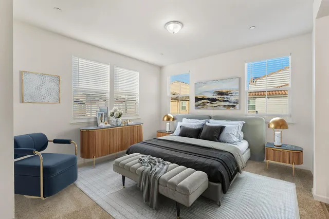 a bedroom with a bed and a couch