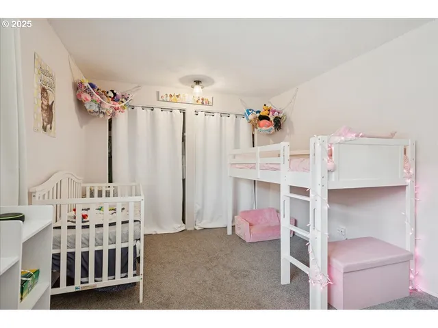 a bedroom with furniture and white walls