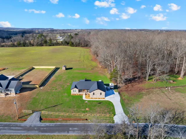 an aerial view of a house with a garden