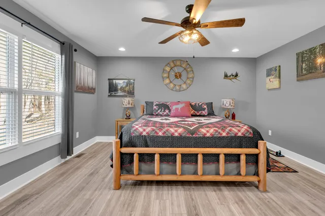 a bedroom with a large bed and a window