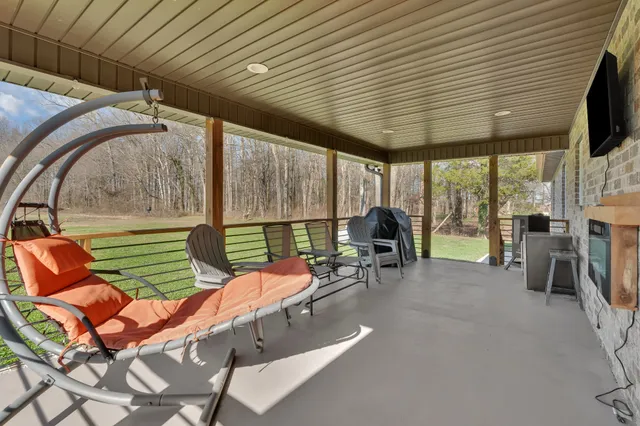 a patio with table and chairs