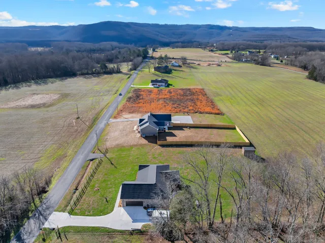 a view of a house with a yard porch and sitting area