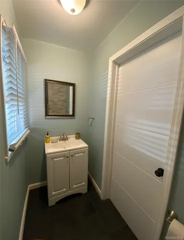 a room with a door and a mirror