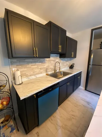 a kitchen with a table and chairs in it