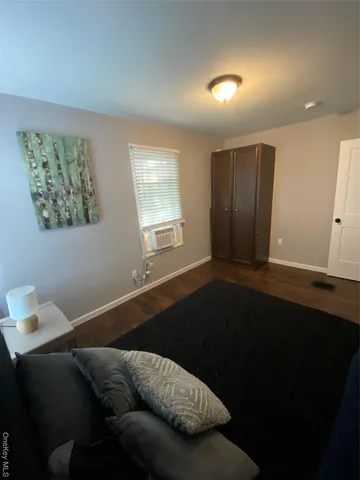 a living room with furniture and window