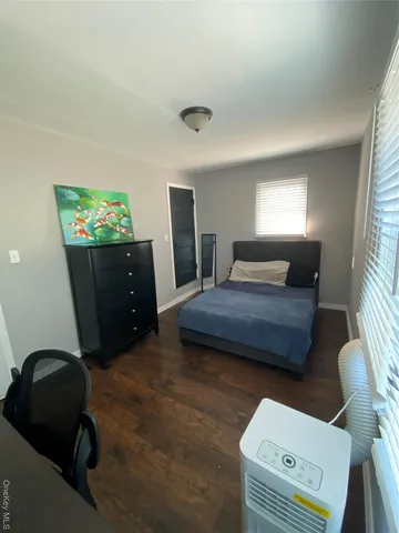 a bathroom with a double vanity sink mirror and toilet