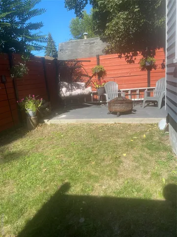 a view of swimming pool from a yard