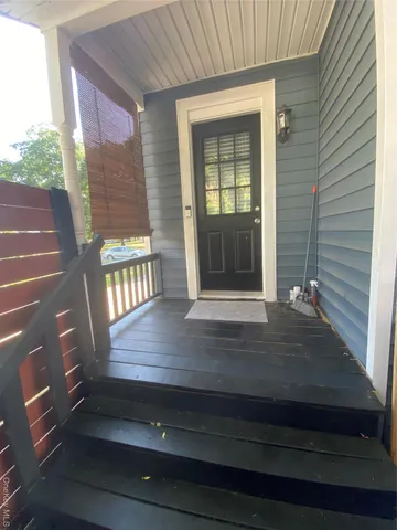 a view of a yard with large trees