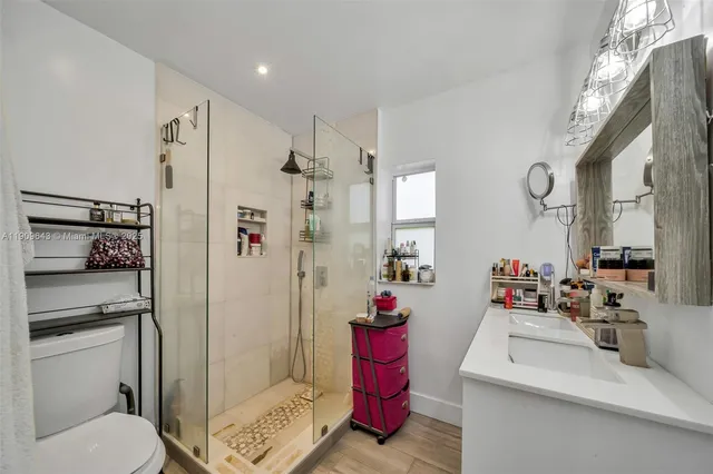 a bedroom with furniture and a window