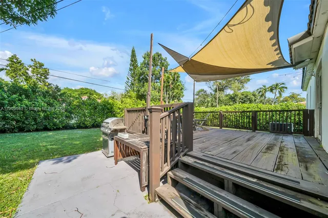 a view of a chairs and table in the balcony