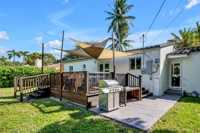 a view of balcony with furniture and garden